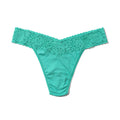 Turquoise lace thong on a white background