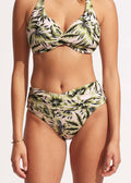 A high waist wrap bikini bottom with a leafy green print, matching the top, providing a full coverage.